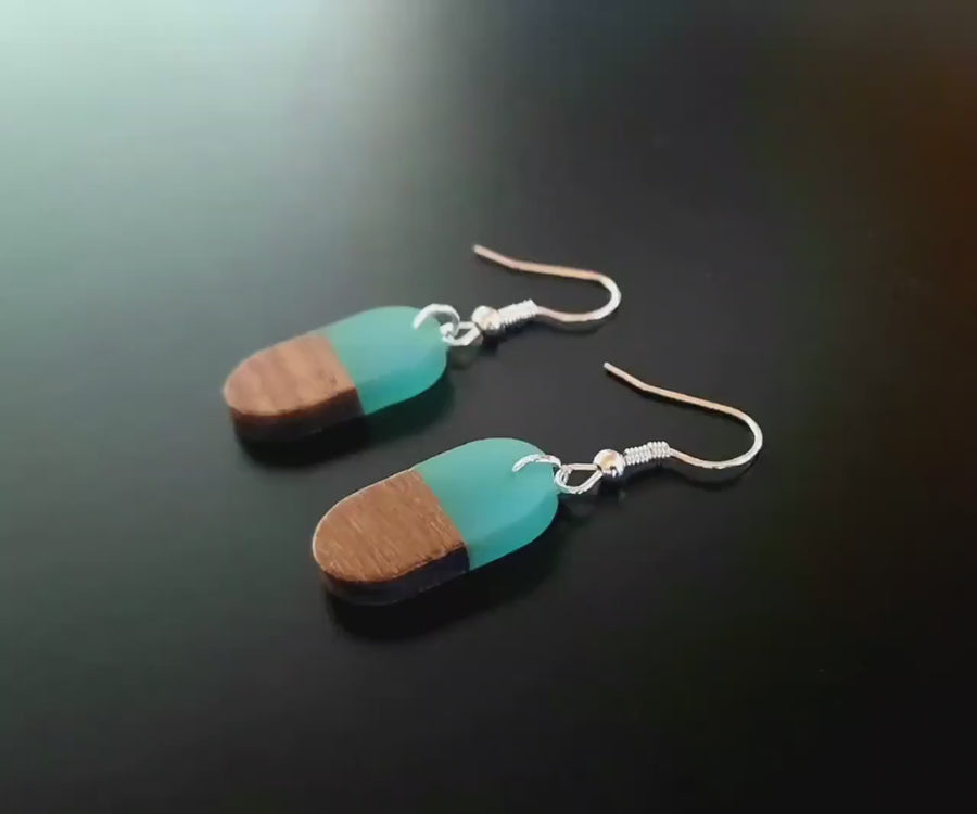 Turquoise-light blue wooden earrings, oval hanging earrings made of walnut wood and turquoise synthetic resin, handmade earrings from Germany, 3 cm