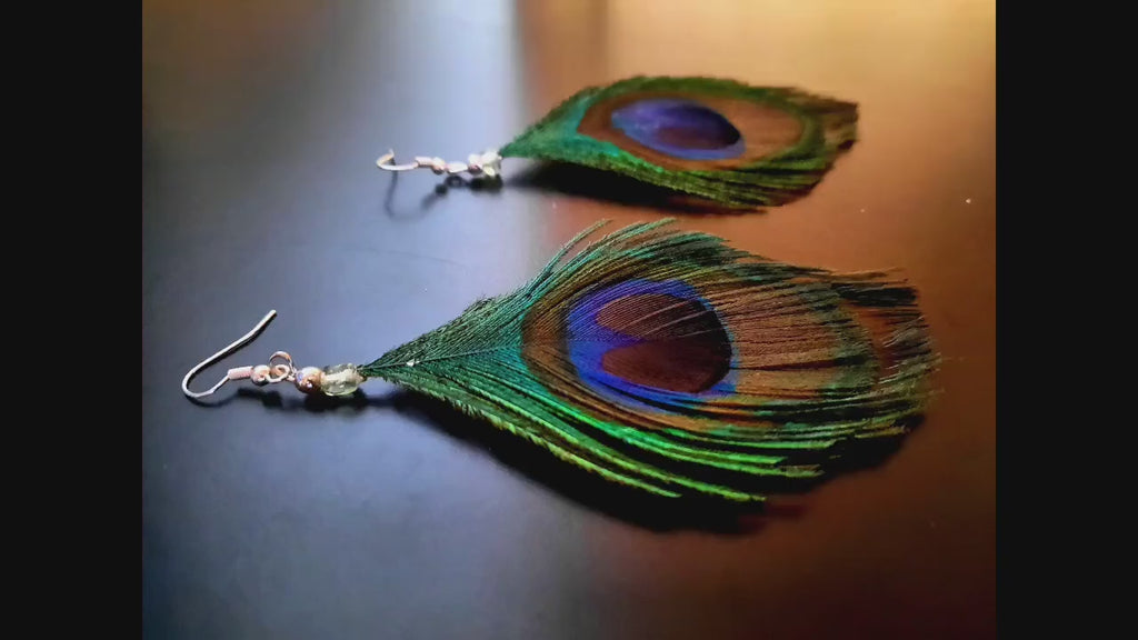 Blue-green-brown peacock earrings, hanging earrings made of peacock feathers and two glass beads (transparent and green-turquoise), handmade, 7 cm long