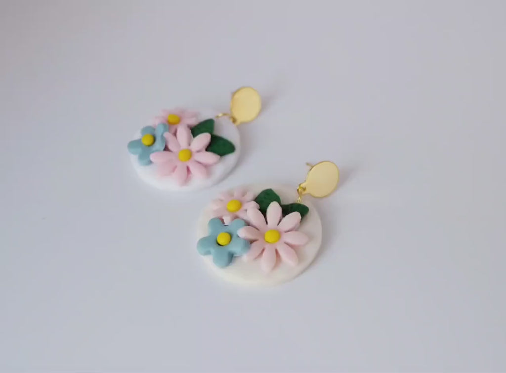 White, round polymerclay earrings with colorful flowers (light blue, pale pink), golden studs, handmade, Germany, 4 cm, creamy white