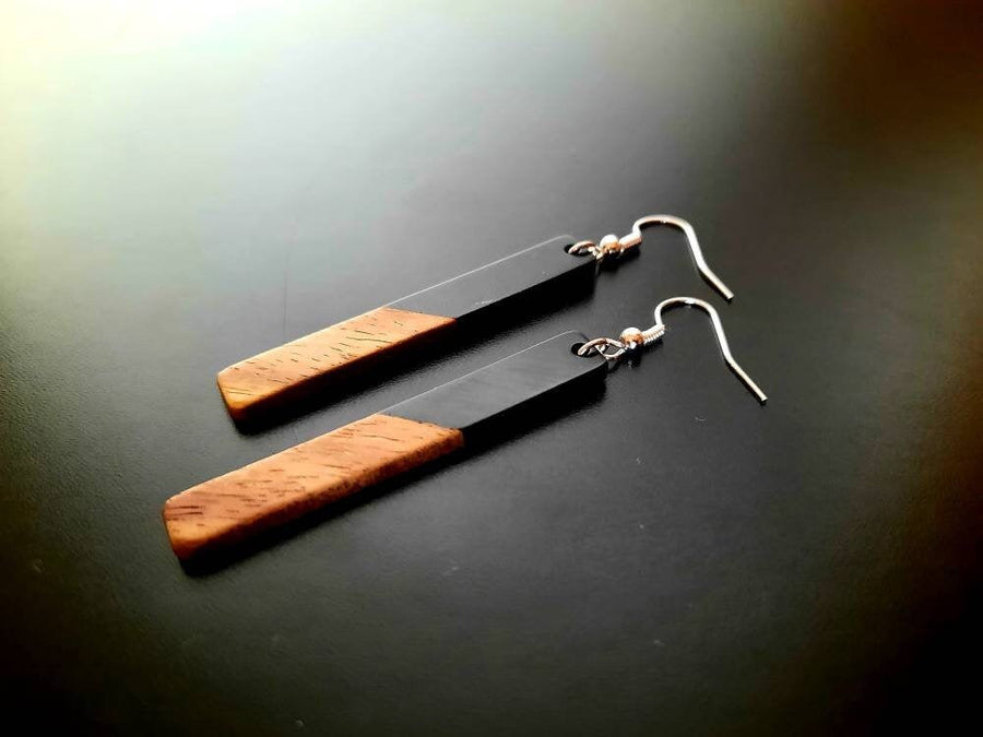 Black-brown wooden earrings in the form of long rods, made of walnut wood and black synthetic resin, handmade earrings, Germany, 7 cm