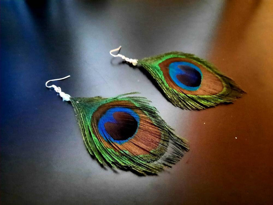 Blue-green-brown peacock earrings, hanging earrings made of peacock feathers and two glass beads (transparent and green-turquoise), handmade, 7 cm long