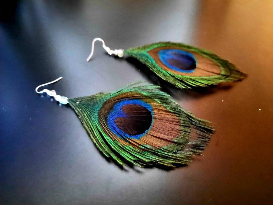 Blue-green-brown peacock earrings, hanging earrings made of peacock feathers and two glass beads (transparent and green-turquoise), handmade, 7 cm long