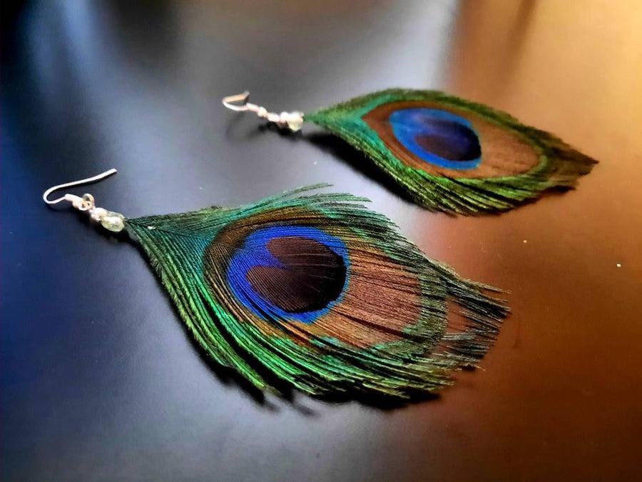 Blue-green-brown peacock earrings, hanging earrings made of peacock feathers and two glass beads (transparent and green-turquoise), handmade, 7 cm long