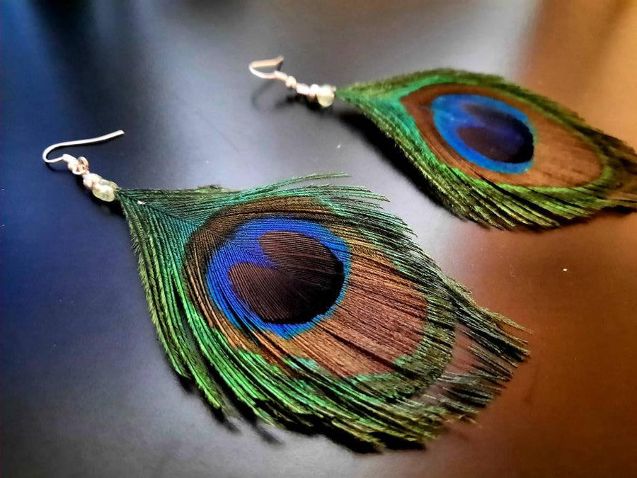 Blue-green-brown peacock earrings, hanging earrings made of peacock feathers and two glass beads (transparent and green-turquoise), handmade, 7 cm long