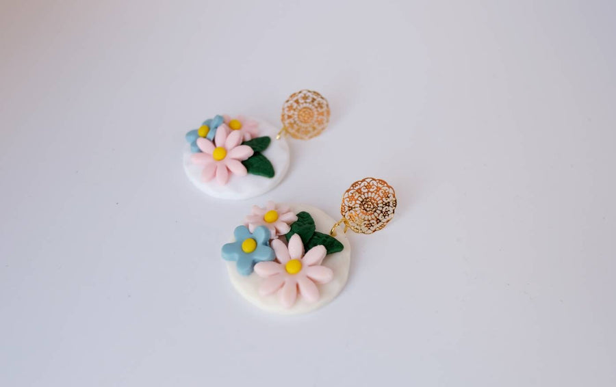 White, round polymerclay earrings with colorful flowers (light blue, pale pink), golden studs, handmade, Germany, 4 cm, creamy white