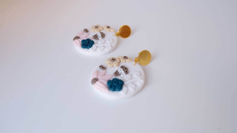 White, round polymerclay earrings with colorful flowers (yellow, blue, pink), ver. golden studs, handmade, Germany, 4 cm, creamy white