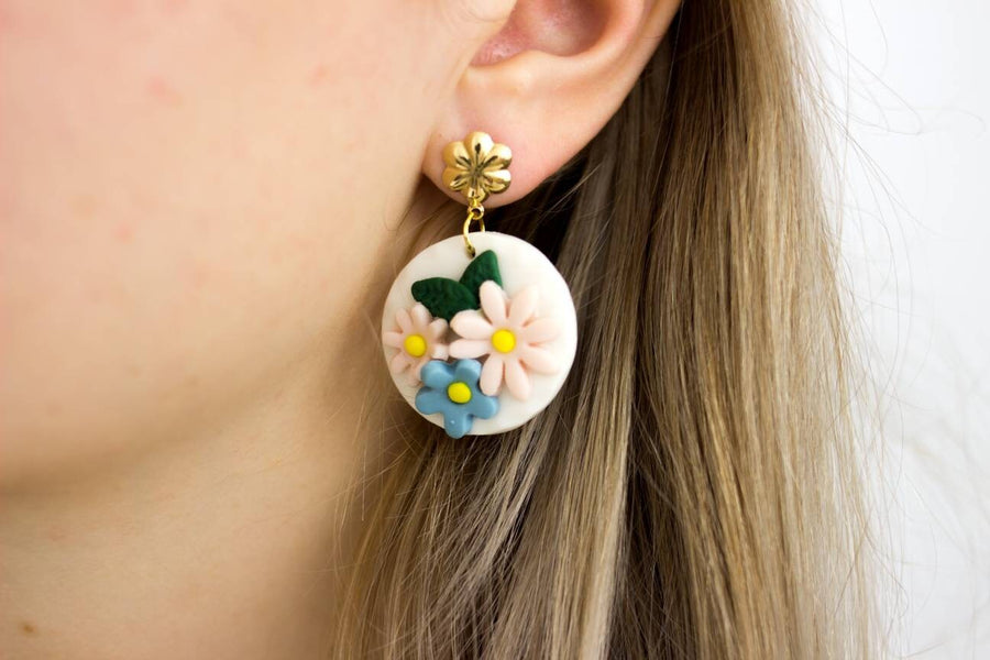 White, round polymerclay earrings with colorful flowers (light blue, pale pink), golden studs, handmade, Germany, 4 cm, creamy white