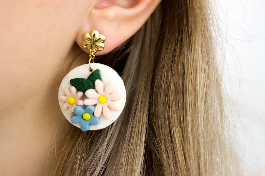 White, round polymerclay earrings with colorful flowers (light blue, pale pink), golden studs, handmade, Germany, 4 cm, creamy white