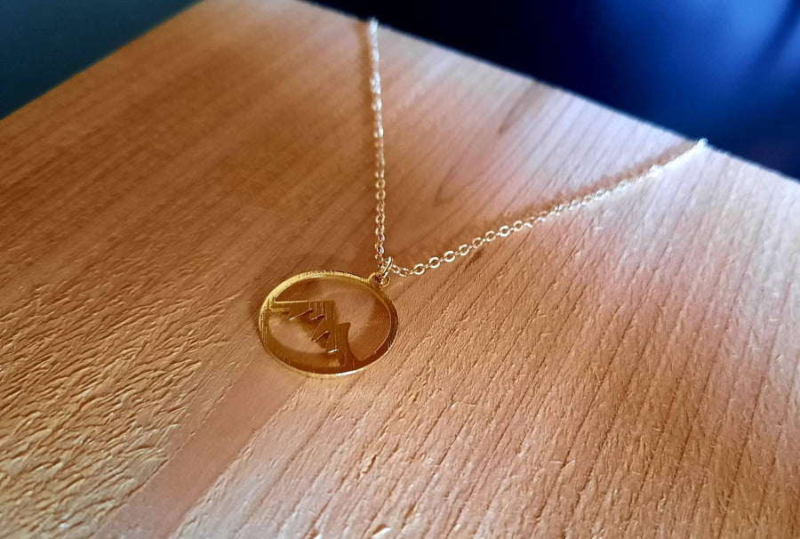 Golden necklace with mountains, gold-plated necklace with round pendant with mountains, brushed circle plated in yellow gold, mountain range, new